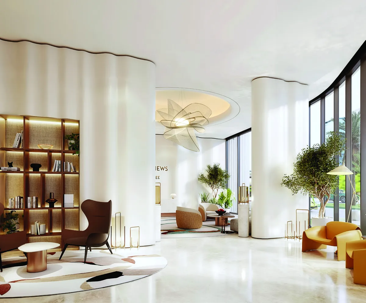 Residents' lounge with library shelving and lounge chairs